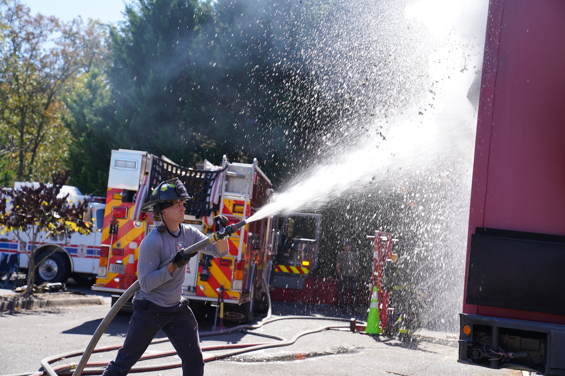 Firefighter recruit conducting hose training at the ACFR training facility
