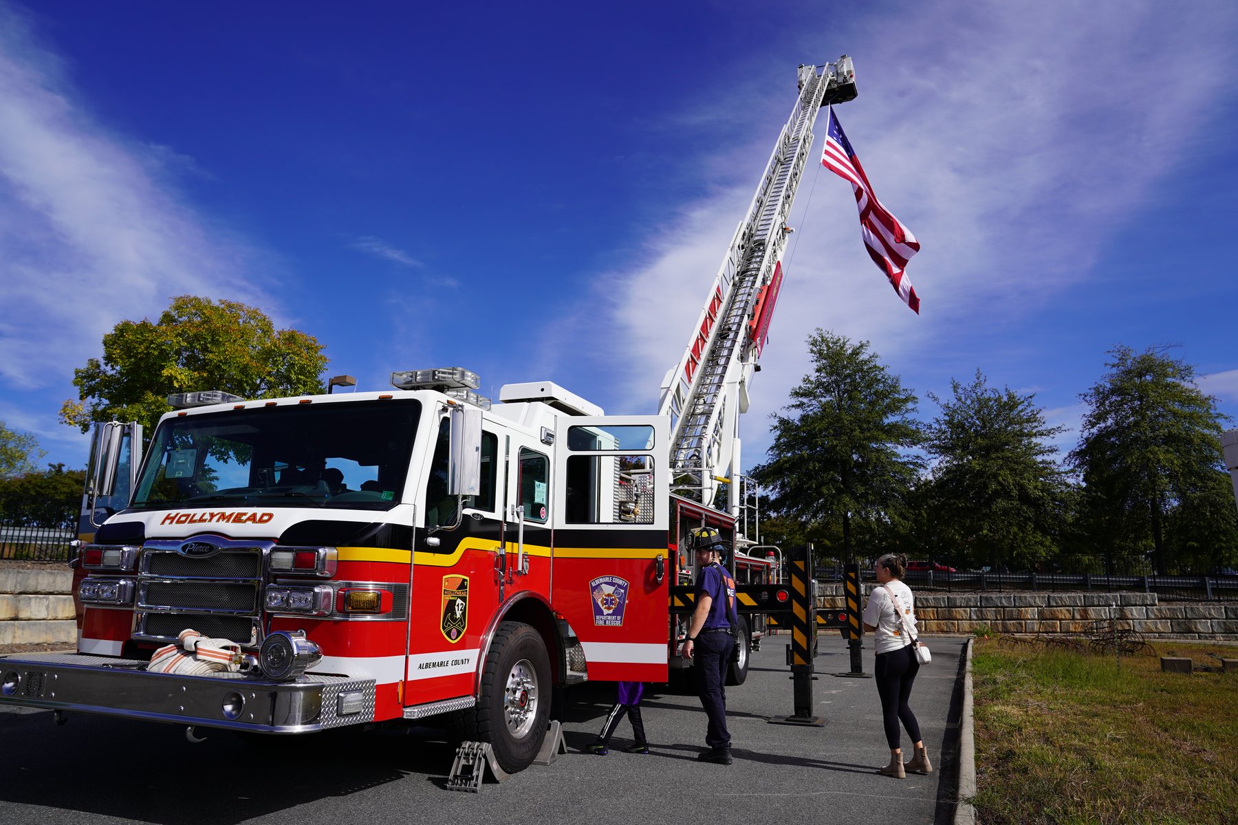 Hollymead Station aerial ladder truck raised with an American flag at the top